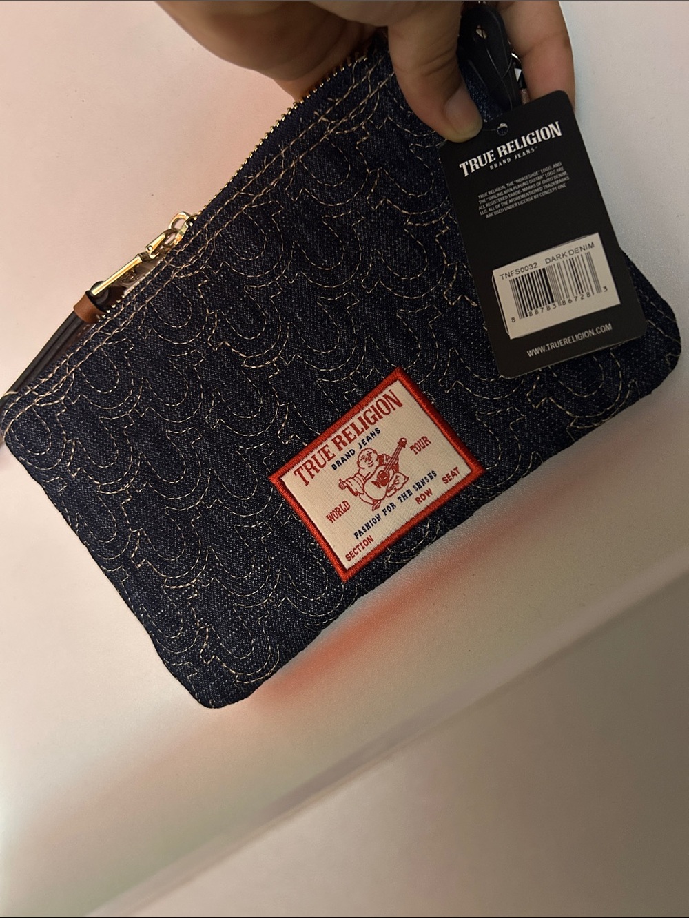 True Religion Quilted Dark Denim Wristlet with Red Logo Patch